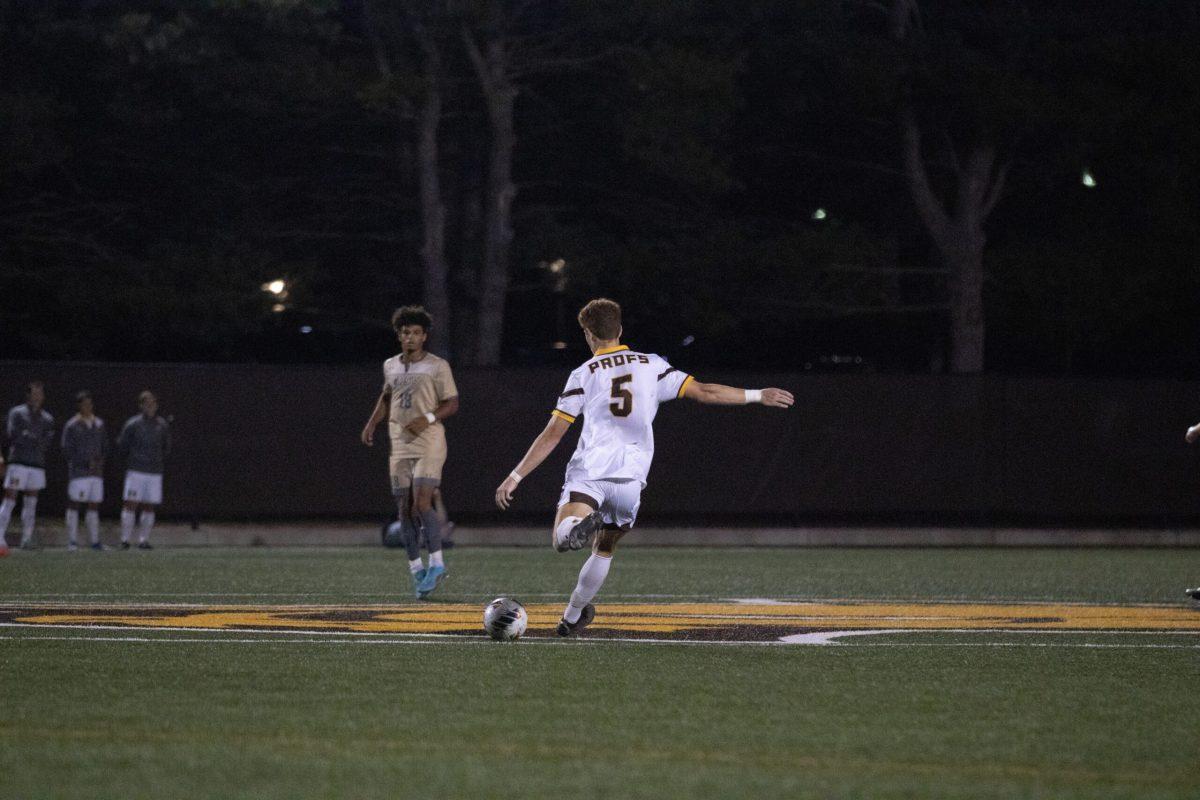 Ryan Cleary kicks the ball at midfield. Cleary scored the first goal of the game against Rutgers-Newark. Saturday, Sept. 17, 2022. - Photo / Dom Francesconi via Rowan Athletics