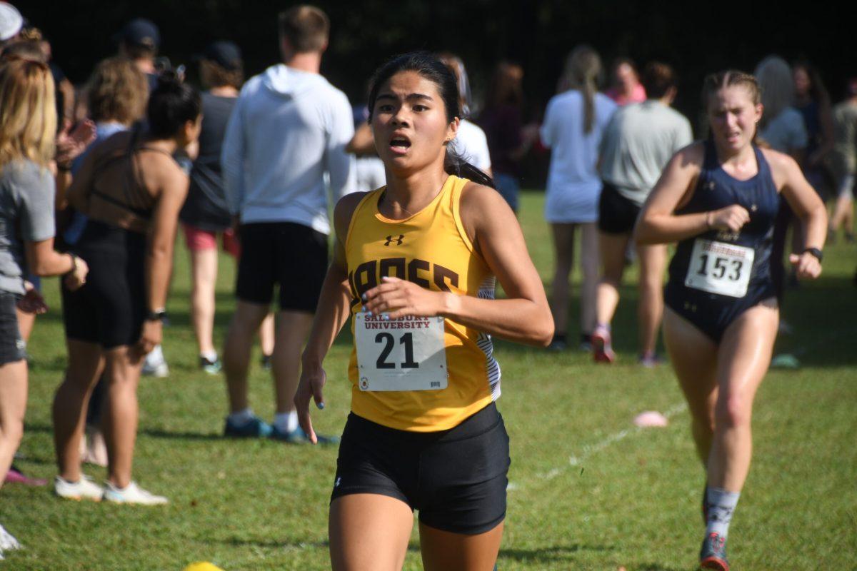 Gabriella Pagano runs during a meet. Pagano has had multiple top three finishes this season for Rowan. - Photo / Lifetouch Photos via Rowan Athletics