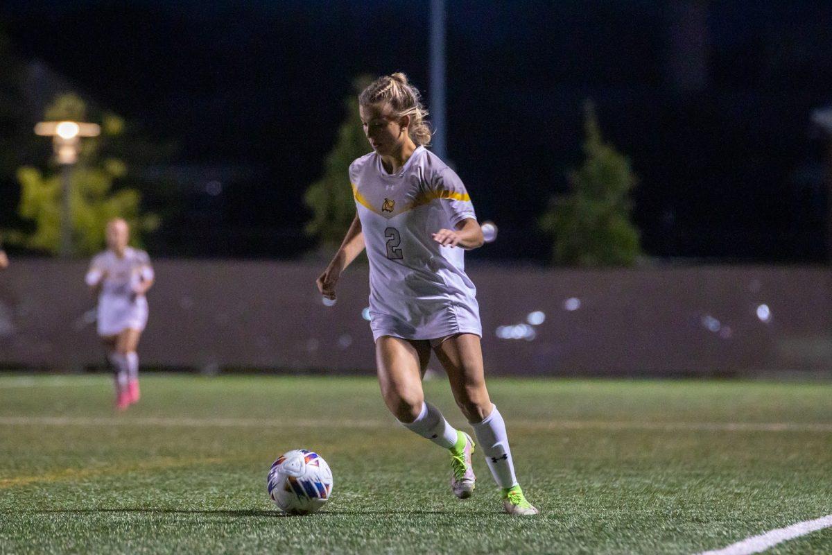 Olivia Giorando dribles the ball up field. Giorando had the best chance of scoring against TCNJ. Wednesday, Sep. 29, 2022. - Multimedia Editor / Lee Kotzen