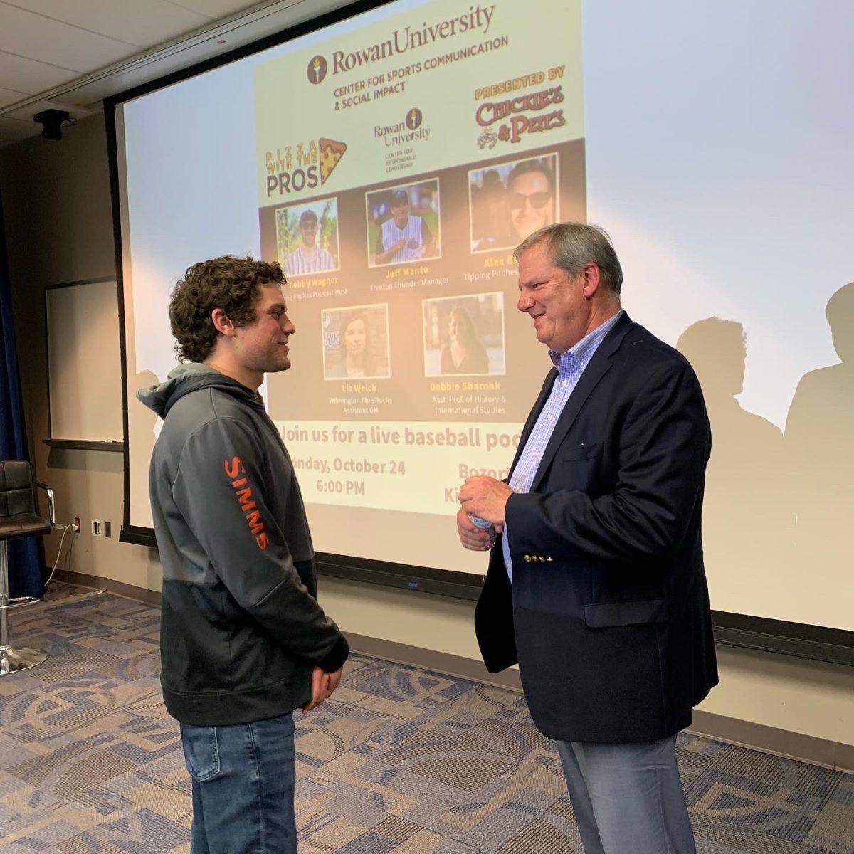 Samuel Dobson speaks to Brian Monihan following his discussion. - Photo via @RowanSportsCam on Twitter