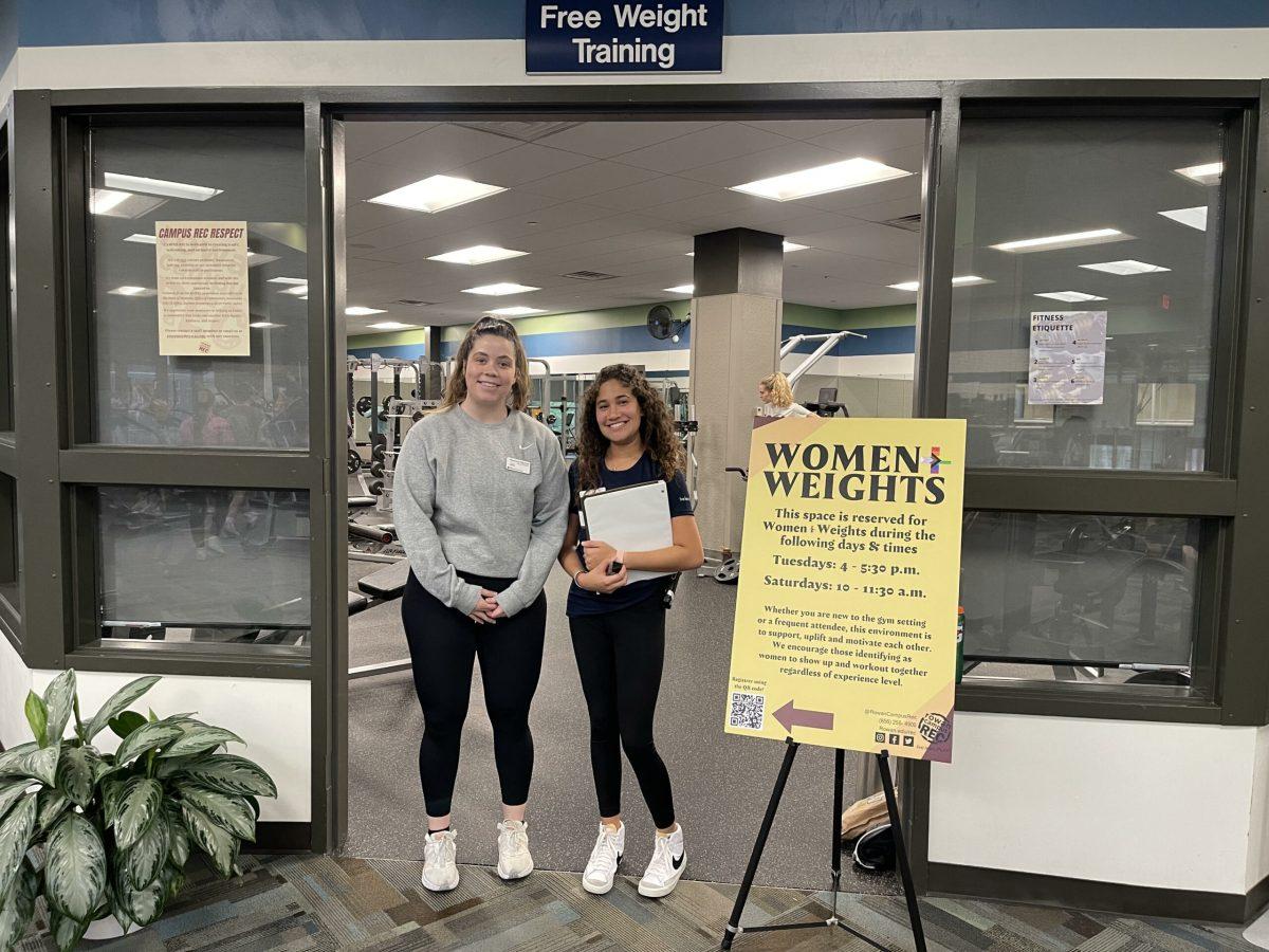 Mackenzie Raymond and Maria Espejo stand at the entrance of the weight room. - Photo / Lawrence Mendoza