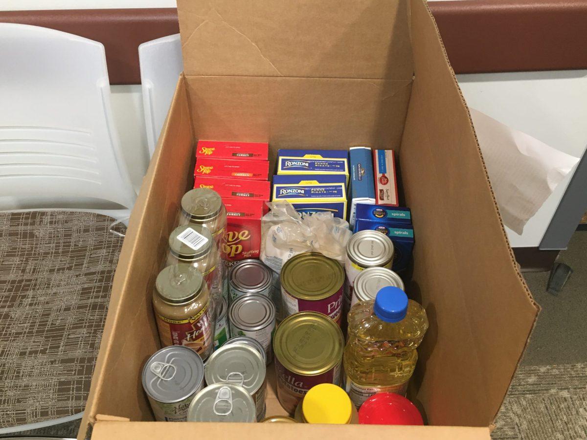 Thanksgiving food donations in a box prepared for distribution to a family in need. - Staff Writer / Abigail Twiford