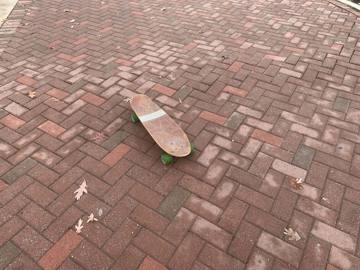 Lopez's skateboard lies on the ground. - Staff Writer / Bryant Lopez