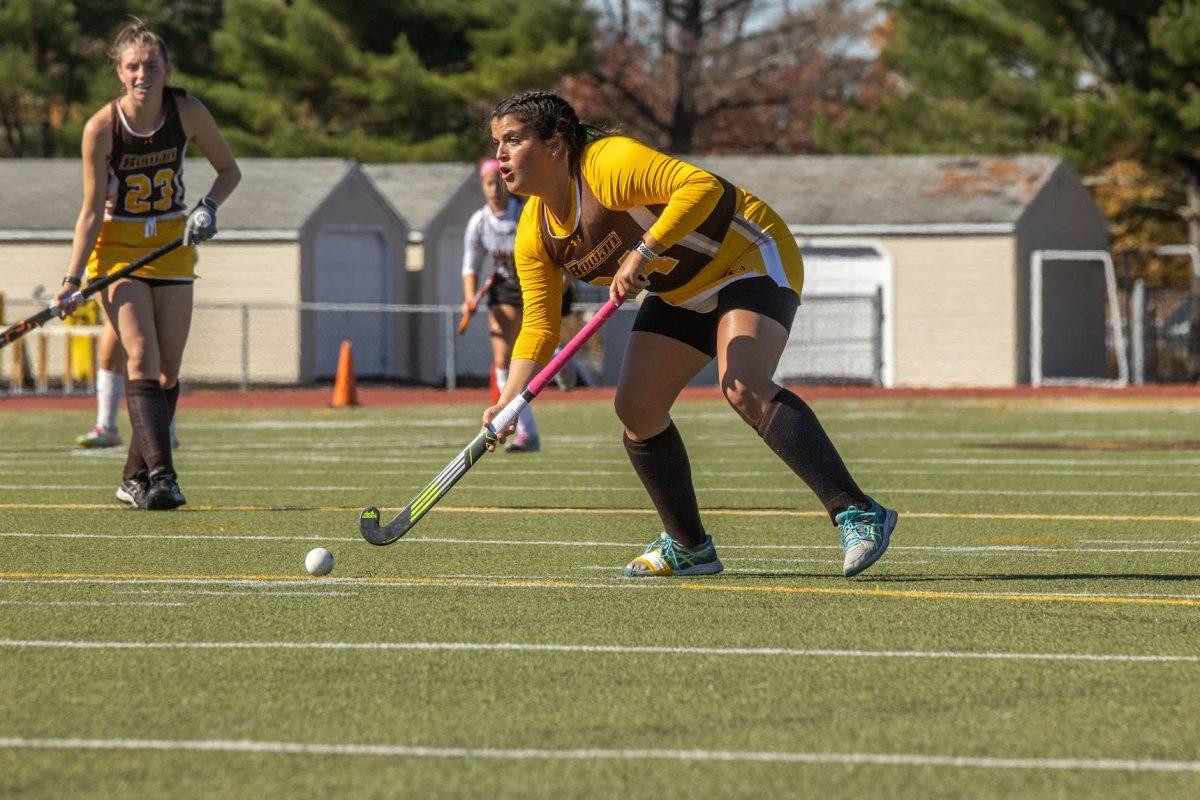 Julia Patrone examines the field with possession of the ball. Patrone scored the game winning penalty stroke against TCNJ for the NJAC Championship. Saturday, Oct. 29, 2022. - Multimedia Editor / Lee Kotzen