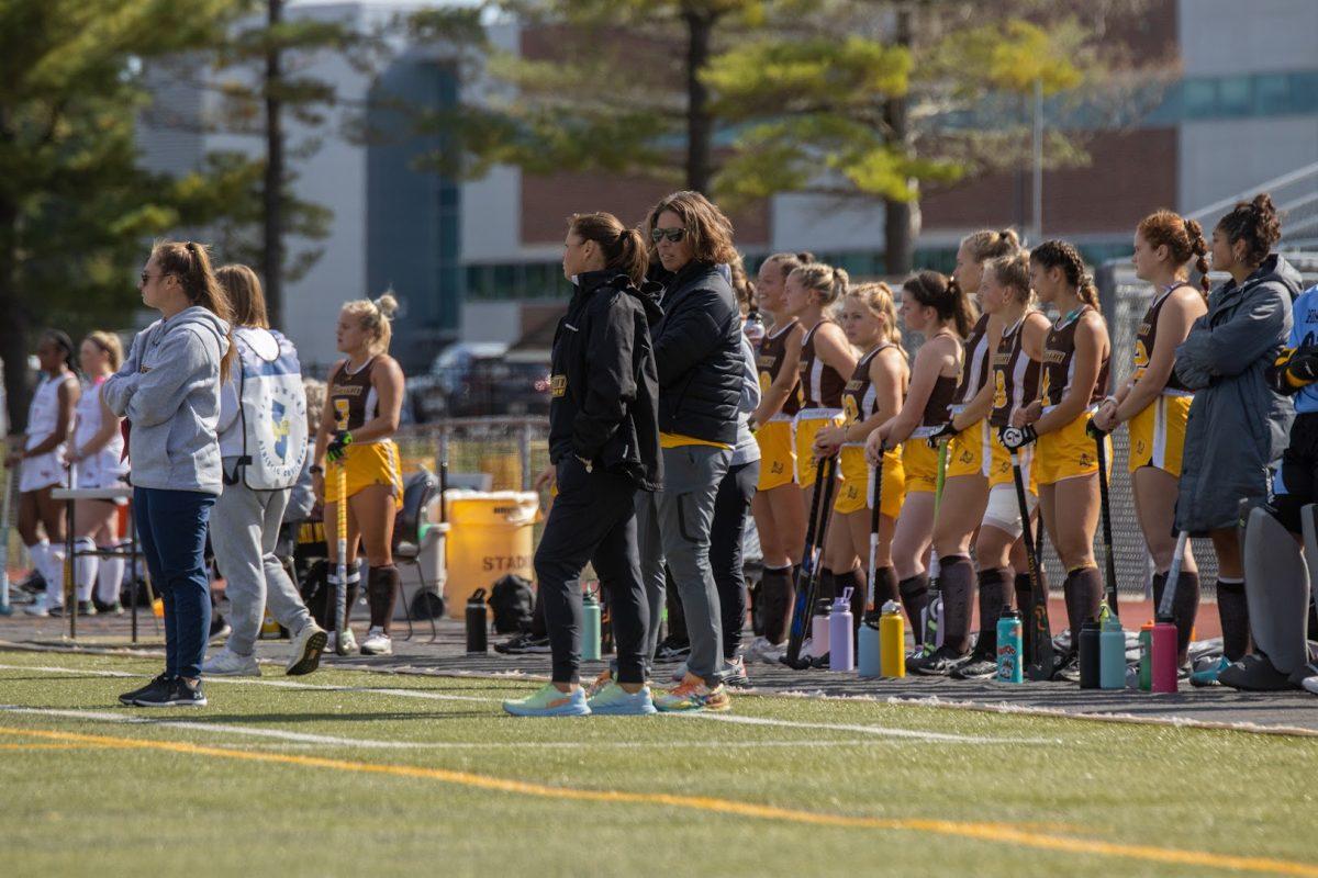 The Rowan field hockey team stands on the sideline. The team finished with a perfect NJAC record this season. Saturday, Oct. 8, 2022. - Multimedia Editor / Lee Kotzen