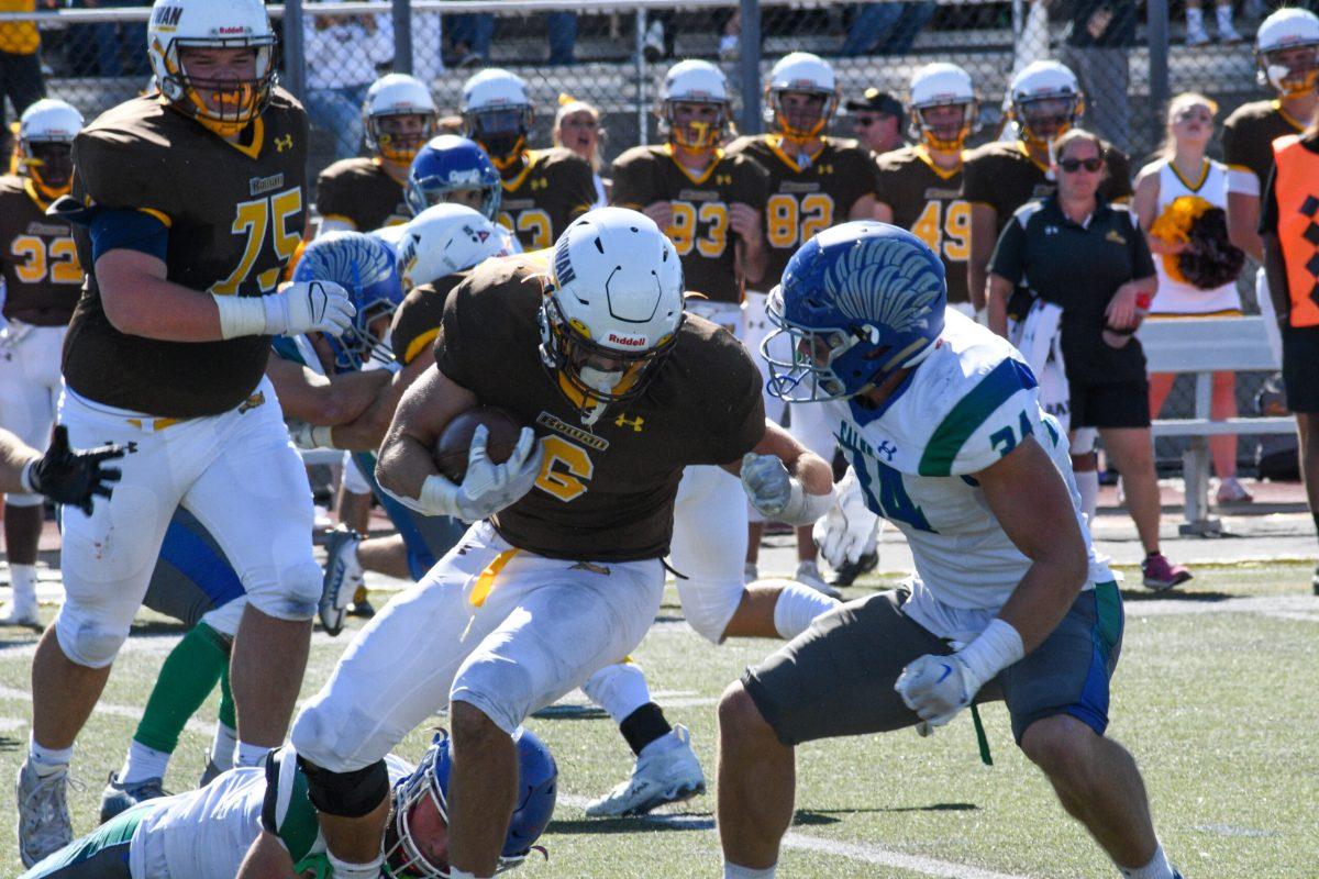 James Fara runs the ball. Fara ran for 124 yard against Montclair State. Saturday, Sept. 24, 2022. - Staff Photgrapher / Tyrese Williams