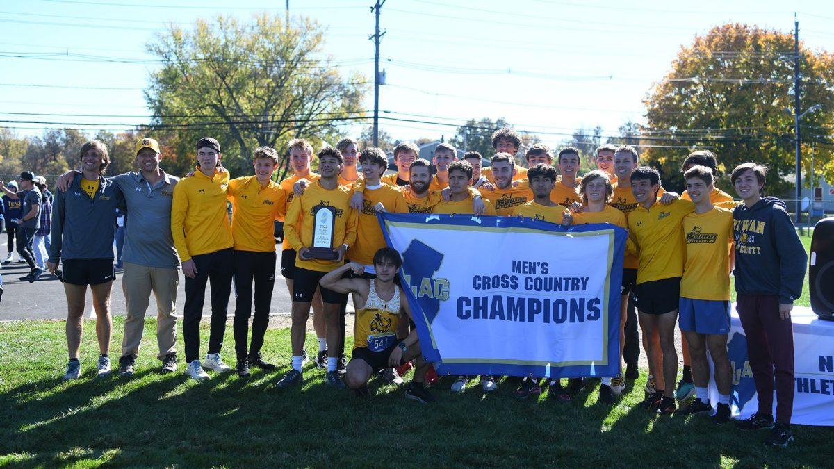 Rowan men's cross country holds their championship banner. - Photo / Rowan Athletics