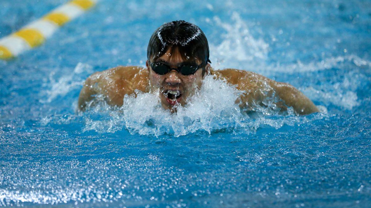 Kevin Yanagisawa comes up from the water during a race. Yanagisawa is an upperclassman on the team. - Photo / Rowan Athletics 