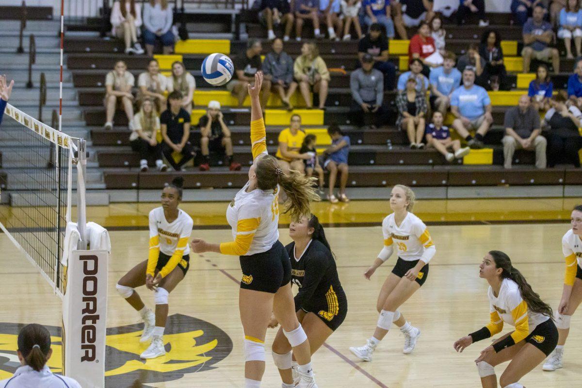 Natalie Ogden goes up to hit the ball to the other side. Ogden tied for the most kills in the match against Montclair. Saturday, Sept. 10, 2022. - Multimedia Editor / Lee Kotzen