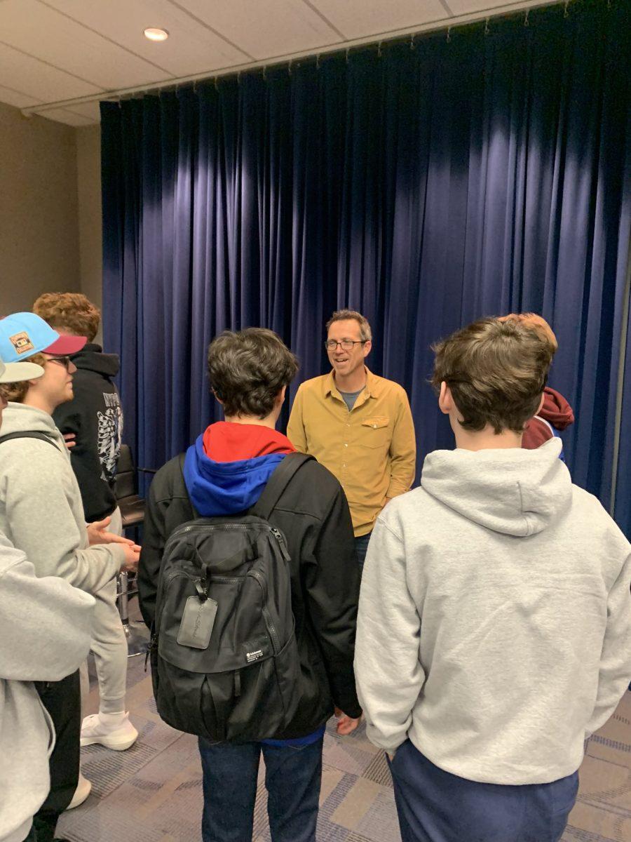 Scott Franzke talks with Rowan students following his discussion. - Photo / @RowanSportsCAM on Twitter.