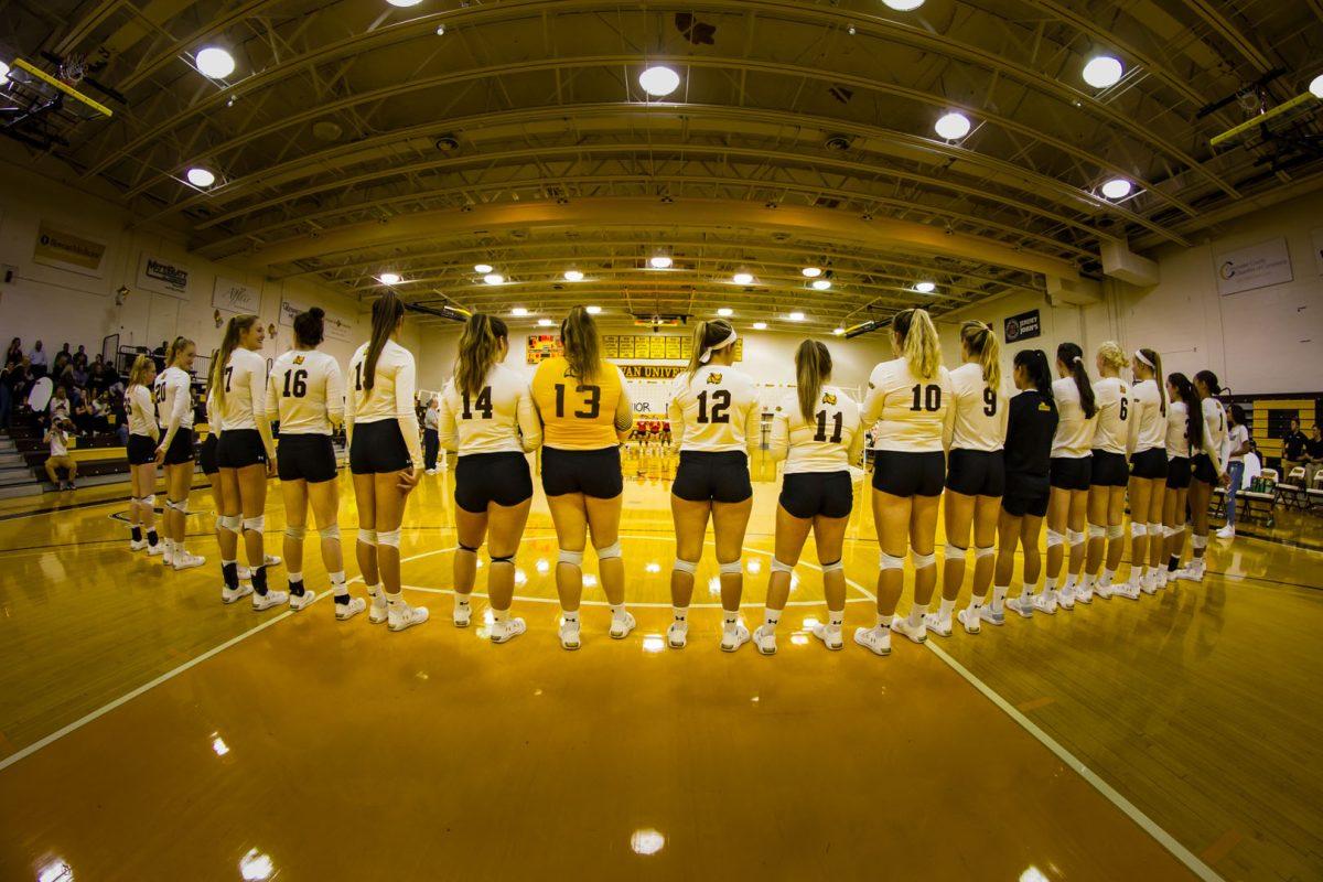 Rowan women’s volleyball stands united before game. - Photo / Rowan Athletics 