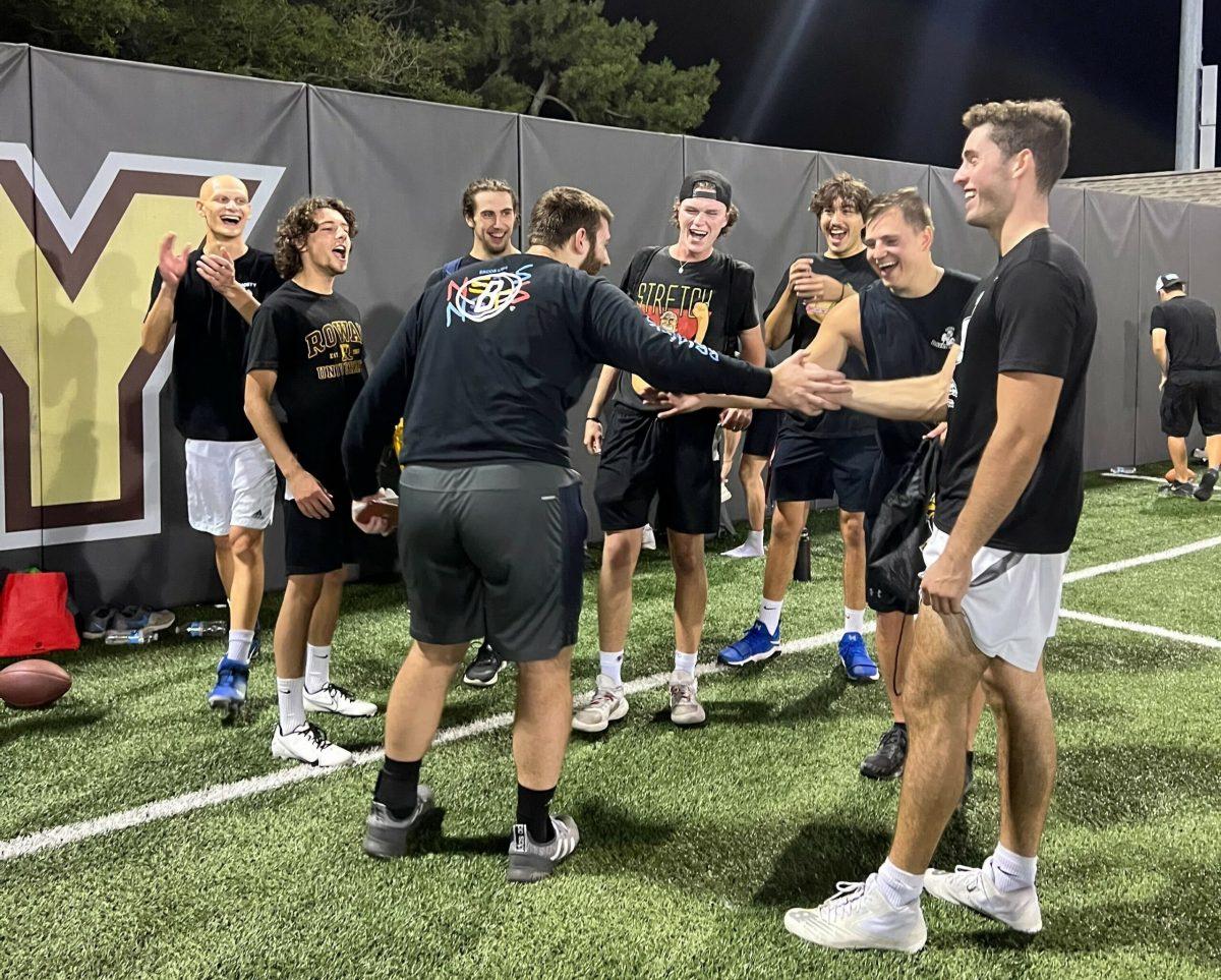 The "Flag Fiends" intramural football team celebrate their win after their game. -  Copy Editor / Sylent Lee Michaels 