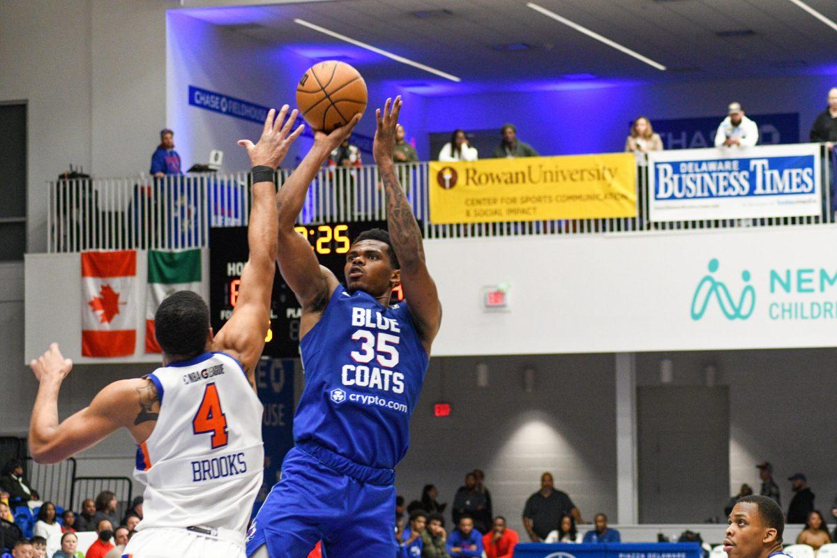 Michael Foster takes a jump shot. Foster led the way in scoring against the Westchester Knicks. Friday, Dec. 9, 2022. - Staff Photographer / Tyrese Williams