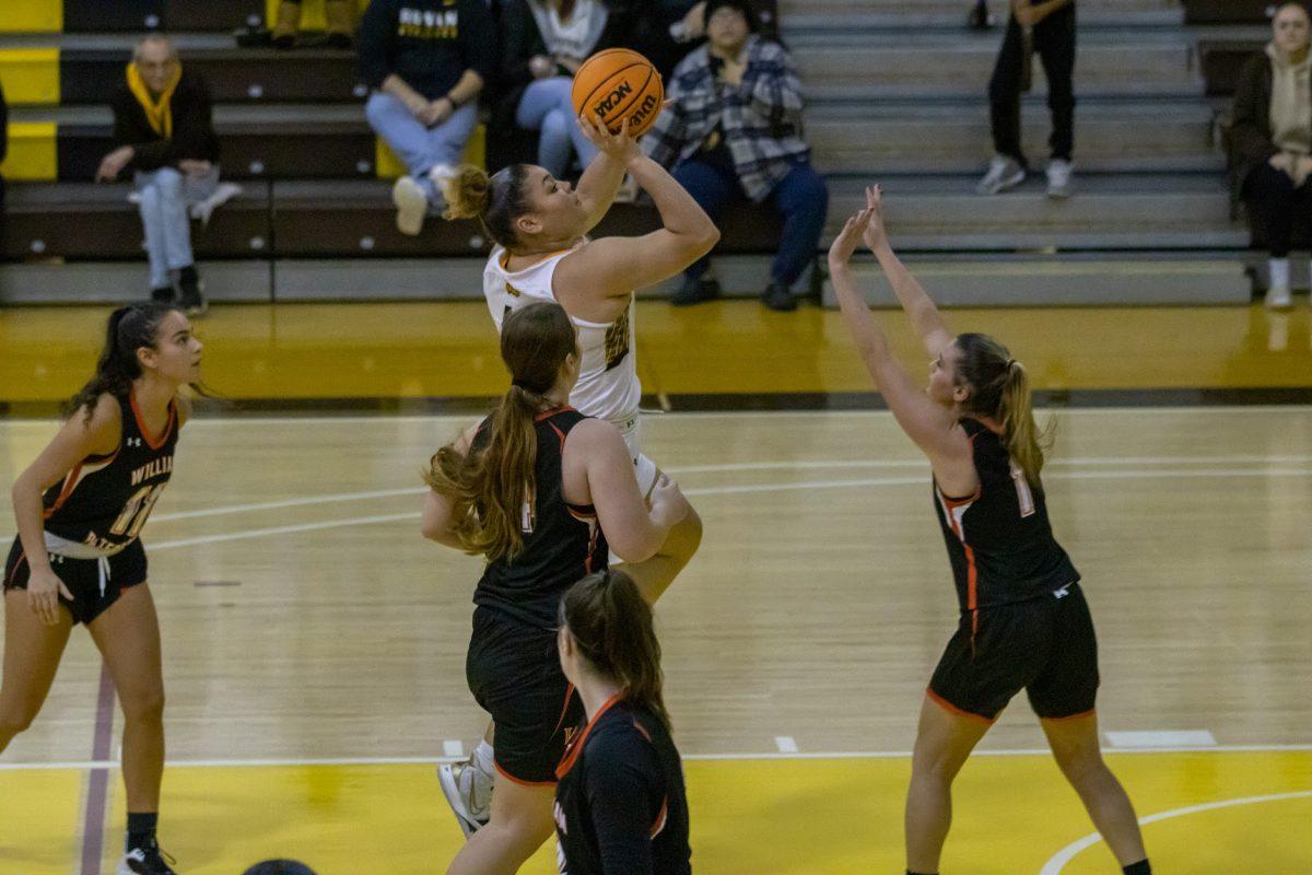 Eliana Santana shoots a floater. Santana was a lead contributor against Rampo. Saturday, Dec. 3, 2022. - Multimedia Editor / Lee Kotzen 