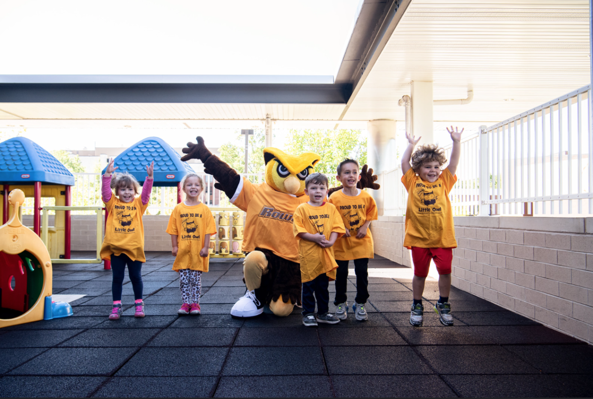 Whoo RU plays with children on the playground at the Rowan University Early Childhood Demonstration Center. - Photo / Rowan University 