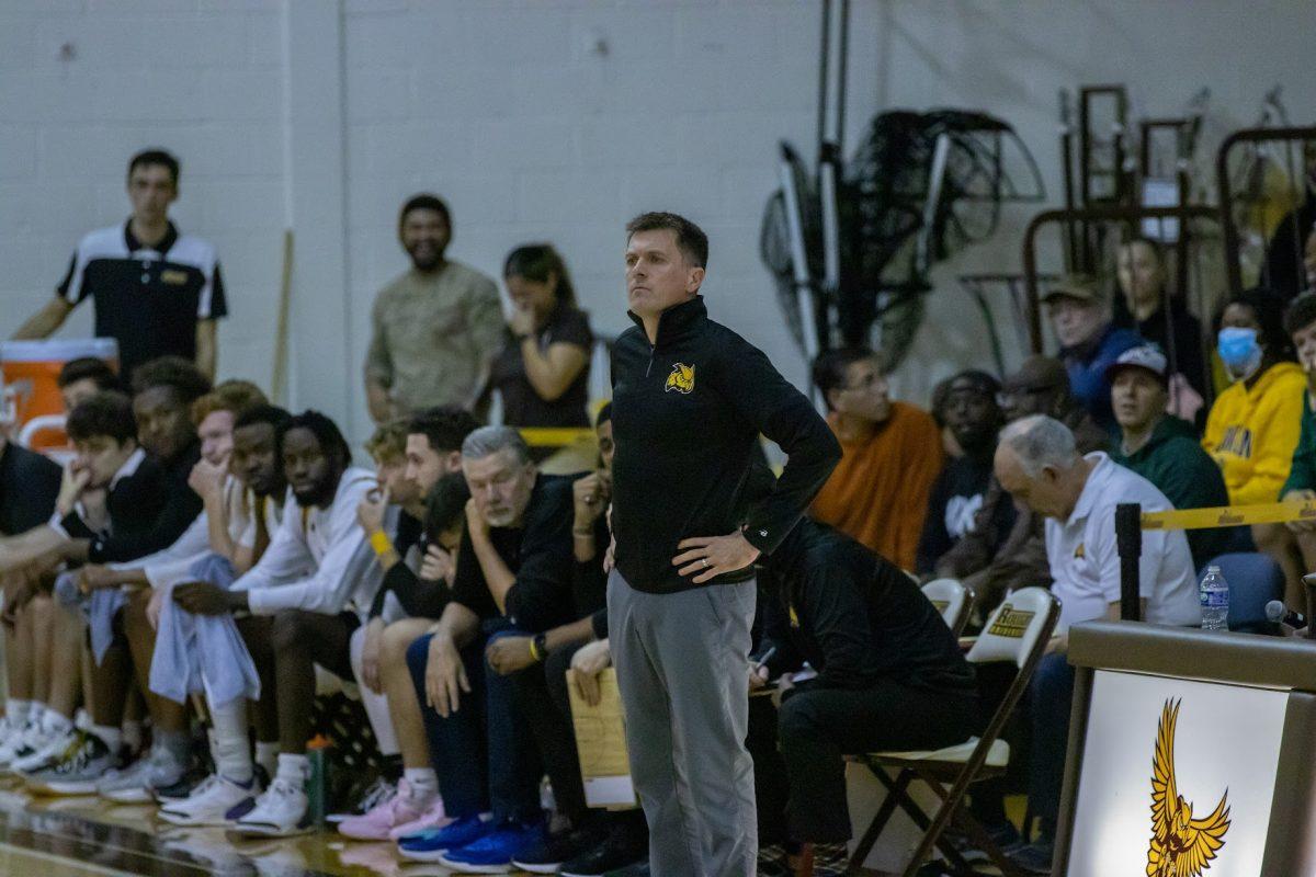 Head Coach Joe Crispin standing on the sideline. Crispin earned his 100th victory with the team against NJCU. Saturday, Dec. 3, 2022. - Multimedia Editor / Lee Kotzen