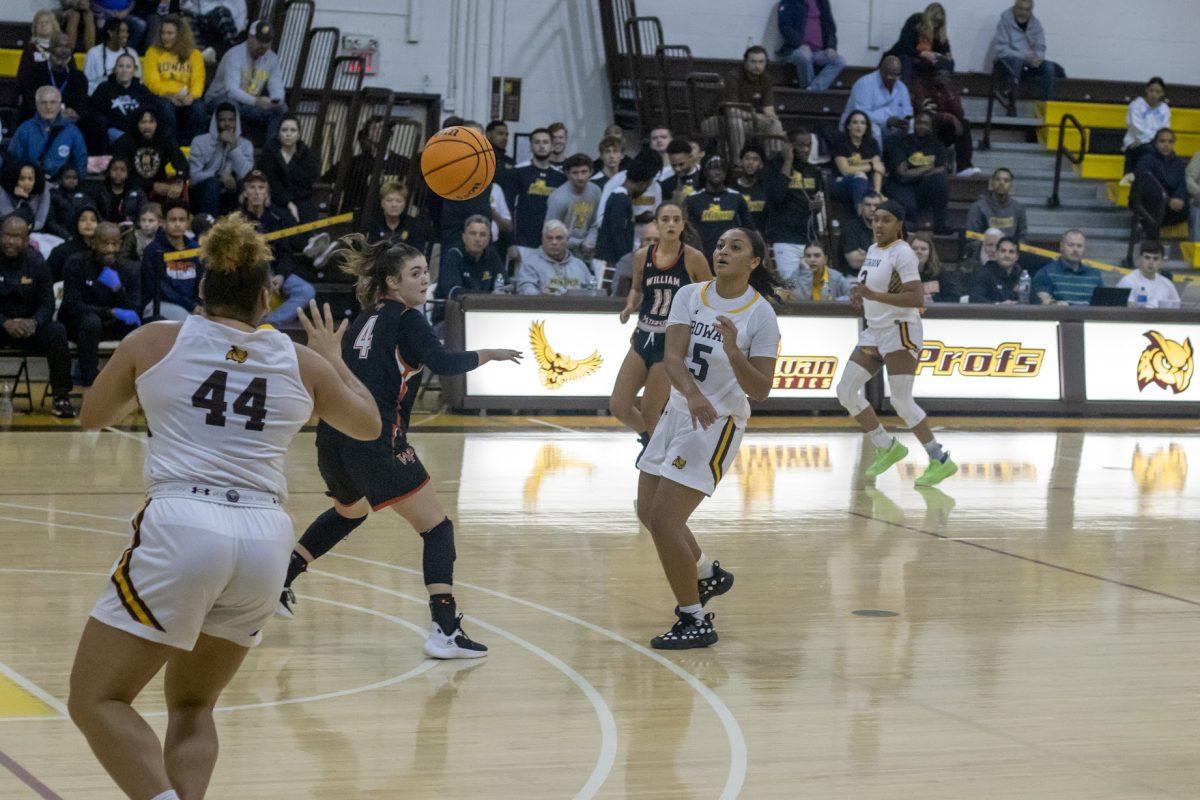 Nicole Mallard passes the ball to Eilana Santana. Santana led the team in points against NJCU. Saturday, Dec. 3, 2022. - Multimedia Editor / Lee Kotzen