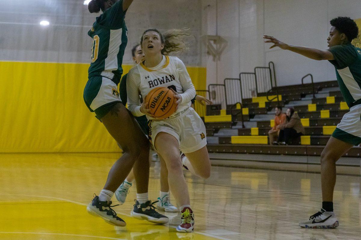 Grace Marshall drives to the basket. Marshall dropped 22 points against Stockton. Wednesday, Jan. 4, 2022. - Multimedia Editor  / Lee Kotzen