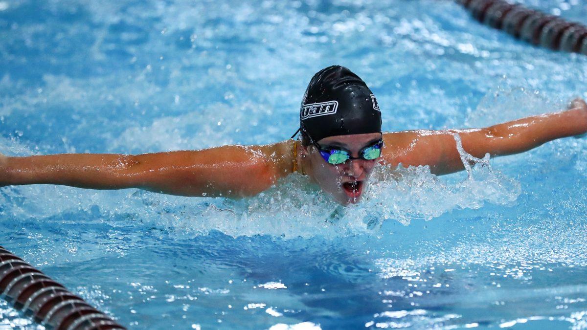 Ella Pennington swims in a race. Pennington broke two school records over the weekend. - Photo / Rowan Athletics