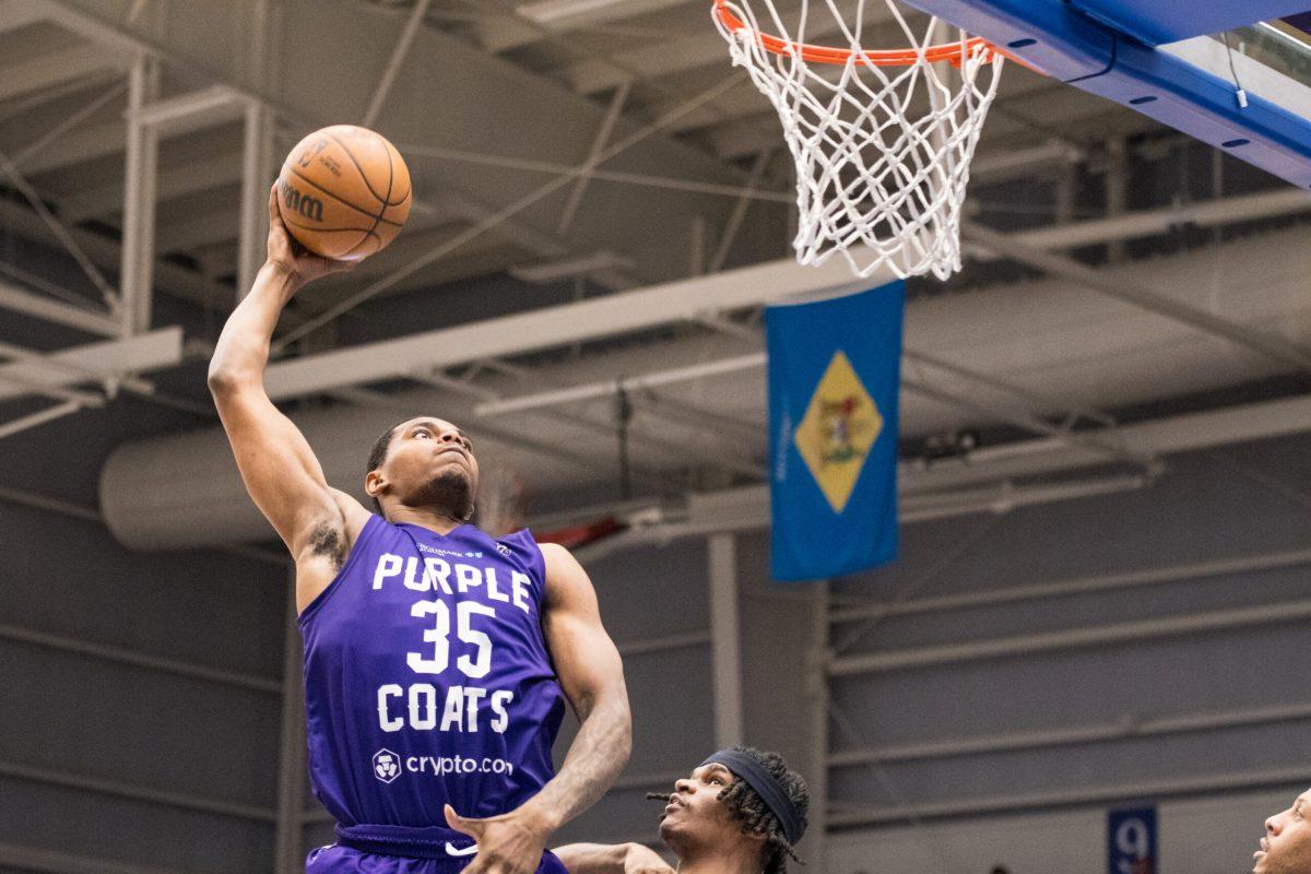 Michael Foster Jr. dunks the ball. Foster Jr. dropped 14 points on the historic night for the Blue Coats. Saturday, Feb. 11, 2023. - Staff Photographer / Tyrese Williams