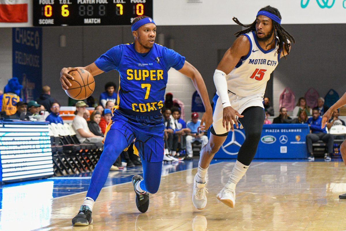 Louis King dribbles past a defender. King was a leading contributor in both games against the Cruise despite their losses. Friday, Feb. 24, 2023. - Staff Photographer / Tyrese Williams