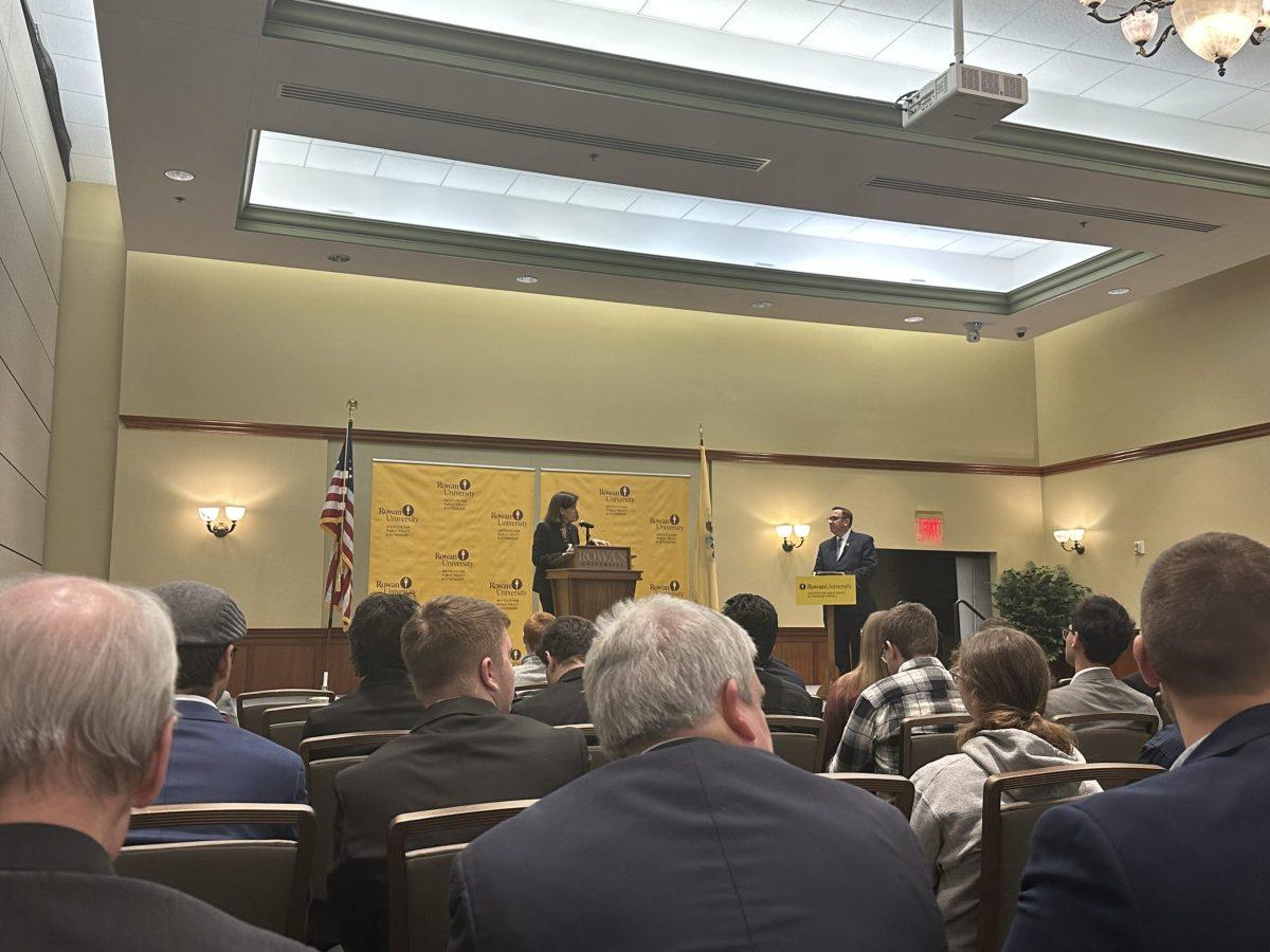 New Jersey State Treasurer Elizabeth Maher Muoio and RIPPAC director Benjamin Dworkin pictured speaking in front of crowd at the Chamberlain Student Center ballroom. - Photo / Connor Brown