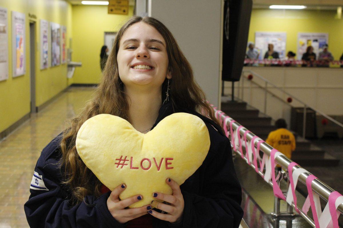 Rowan student Julianna Gore showing off her pillow. - Staff Writer / Elena Laughton