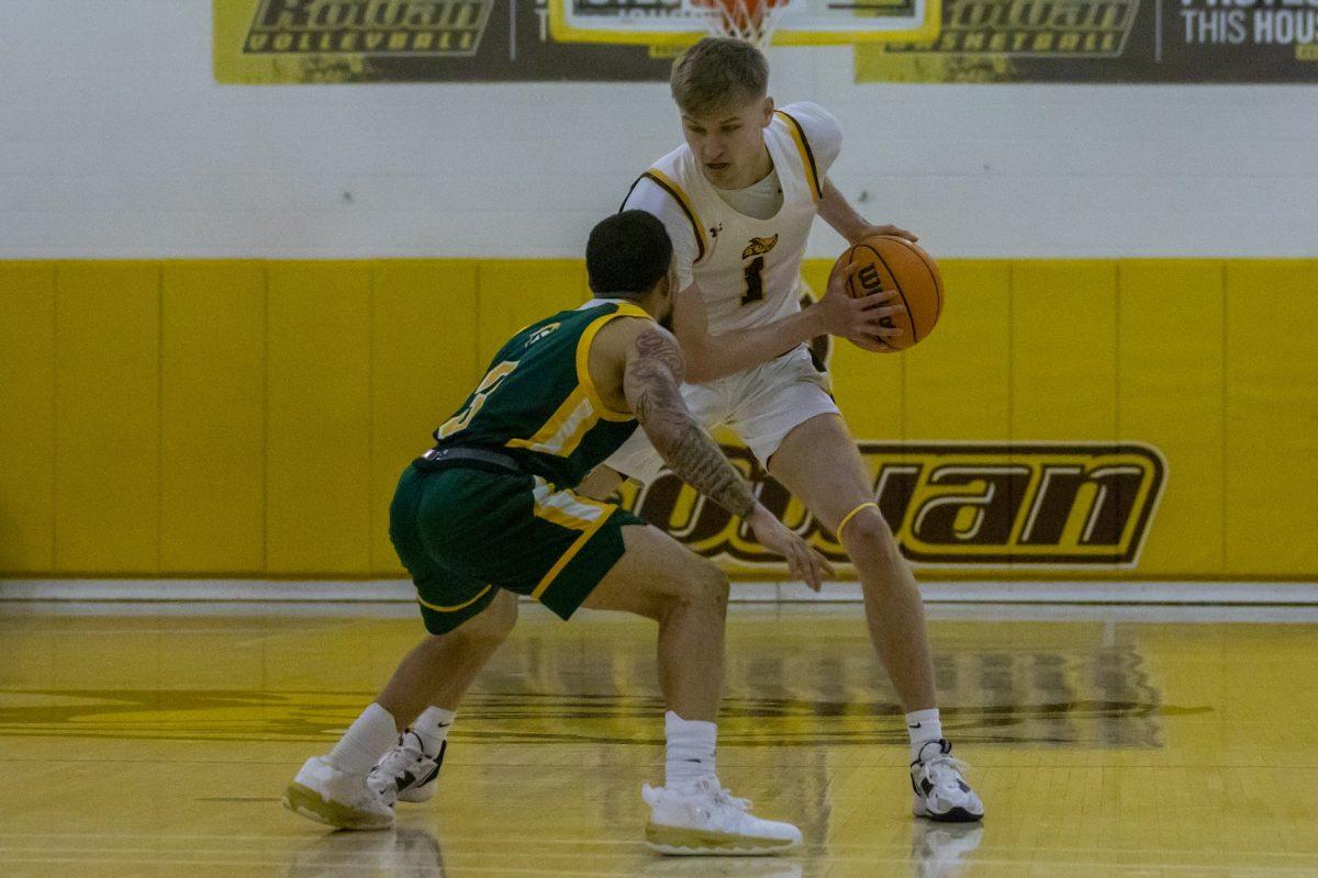 Andrew Seager controls the ball in front of a defender. Seager was one of the leading scorers against Rutgers-Newark. Wednesday, Jan. 4, 2023. - Mulitmedia Editor / Lee Kotzen