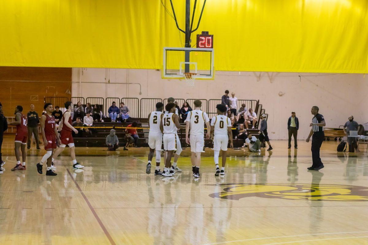 Rowan men's basketball players have a discussion after a timeout. The team would be unable to pick up the win against Montclair. Wednesday, Feb. 15, 2023. - Multimedia Editor / Lee Kotzen