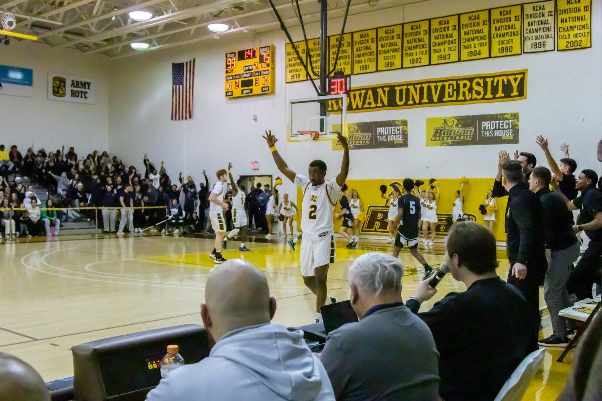 Marcellus Ross and the crowd at Esby celebrates. This basketball was one of seven threes for Ross. Friday, Feb. 24, 2023. - Multimedia Editor / Lee Kotzen