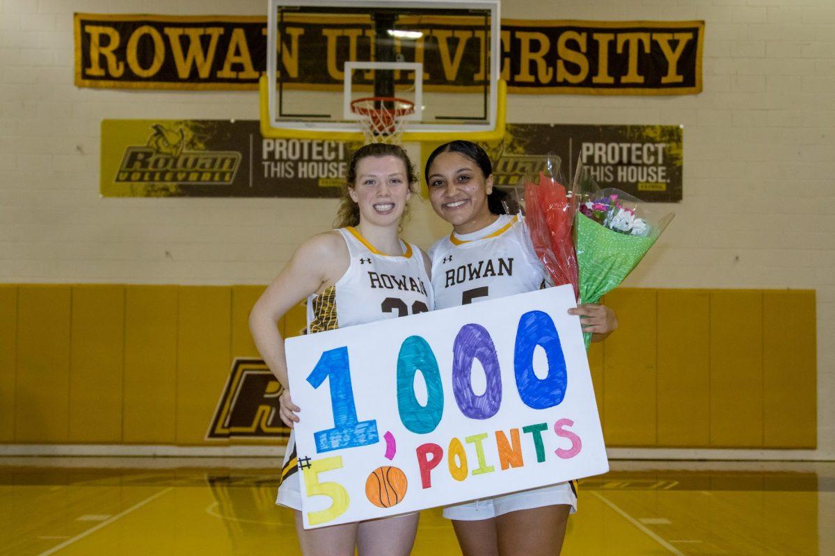 (Left to right) Grace Marshall and Nicole Mallard pose after Mallard's 1,000 point. The two have now both achieved this accomplishment. Wednesday, Feb. 2, 2023. - Multimedia Editor / Lee Kotzen