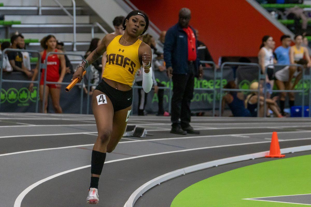 Nevaeh Lorjuste runs her leg of the 4x400. Lorjuste was part of the record breaking 4x400 team. Friday, Feb. 3, 2023. - Multimedia Editor / Lee Kotzen