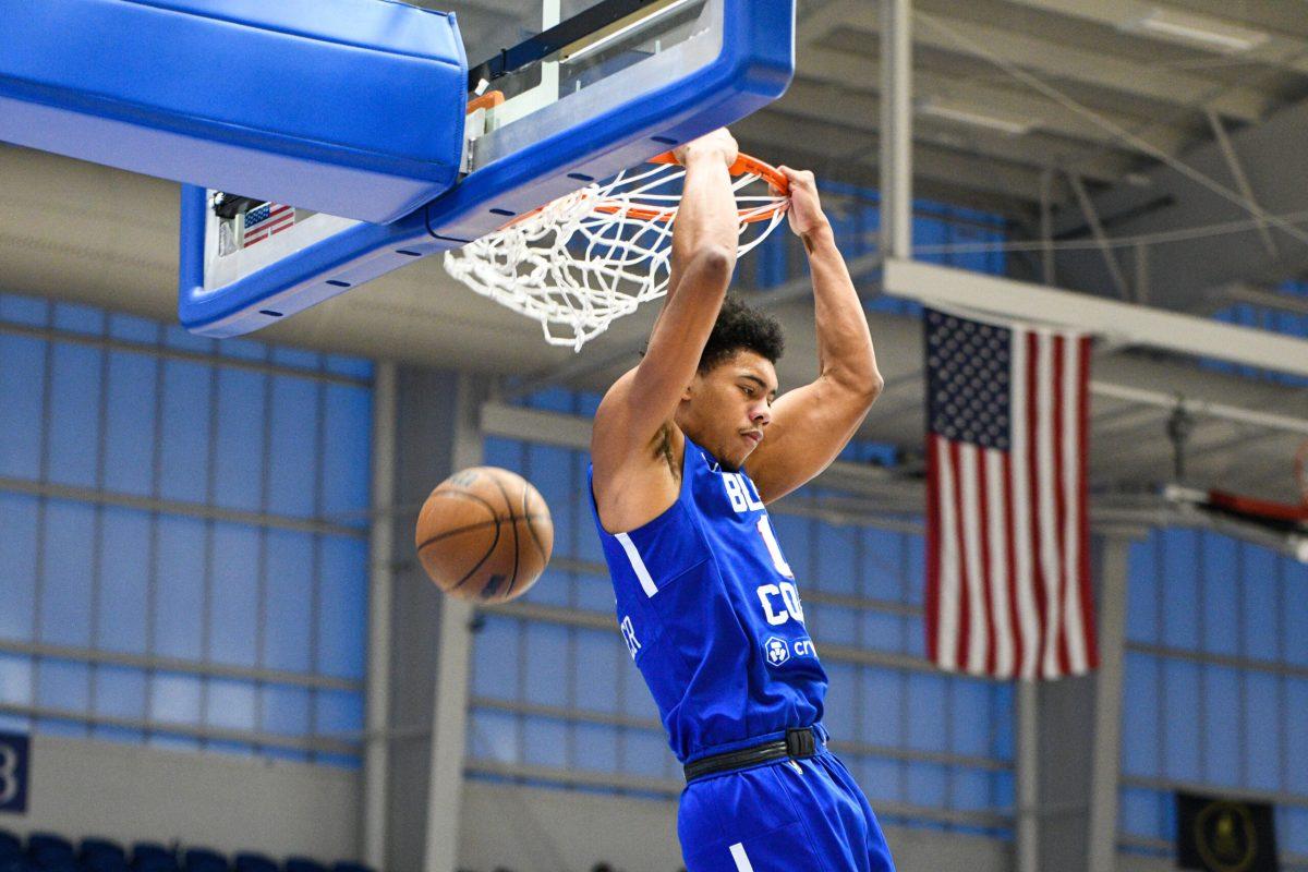 Jaden Springer throws down a reverse jam, backdropped by the Fieldhouse's grand windows. Tuesday, Mar. 14, 2023. - Staff Photographer / Tyrese Williams