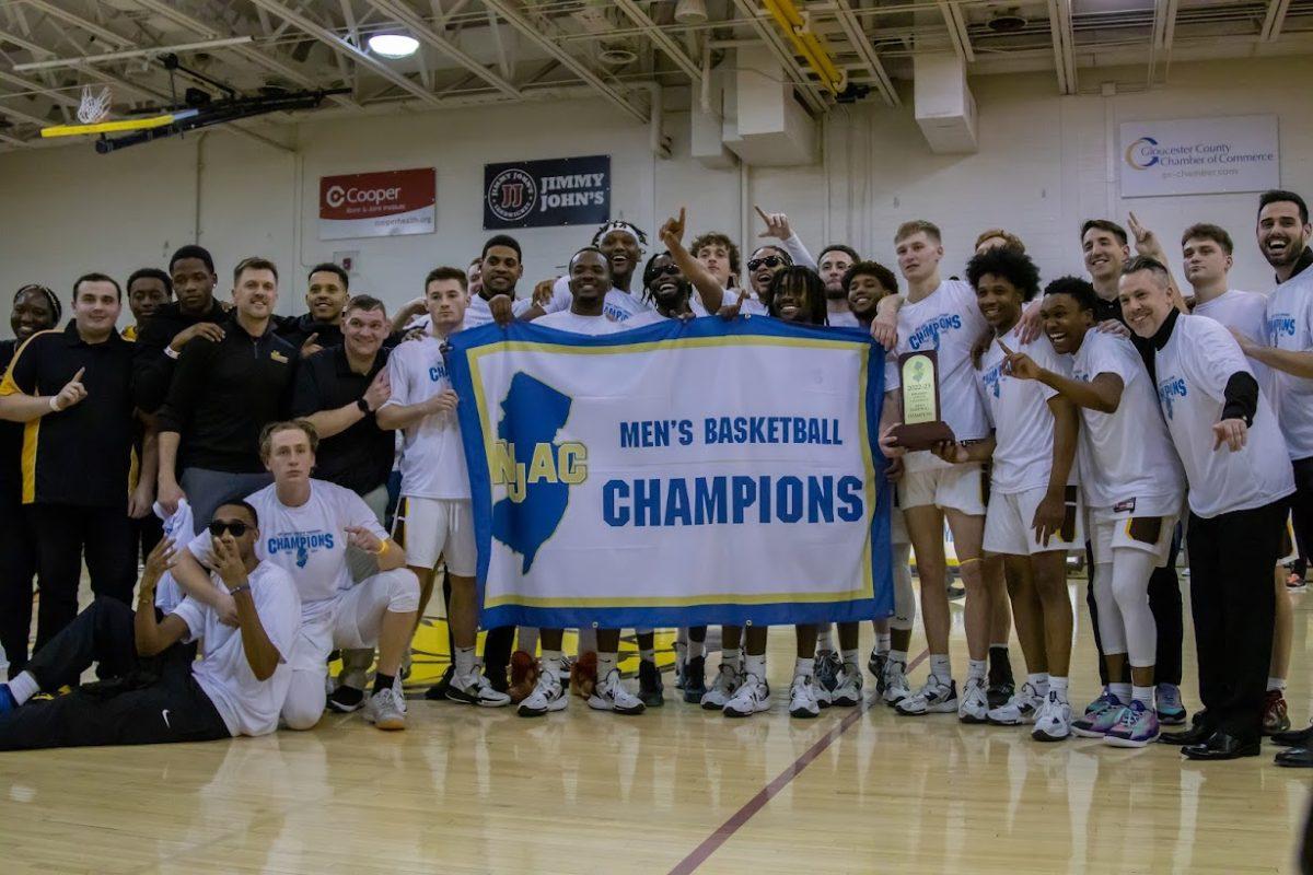 Rowan Men's Basketball celebrates their NJAC Championship Game win. Friday, Feb. 24, 2023. - Multimedia Editor / Lee Kotzen