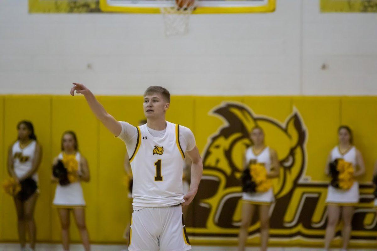 Andrew Seager directs his team. Seager had 23 points and 10 rebounds in the second round against Utica. Friday, Feb. 24, 2023. - Multimedia Editor / Lee Kotzen