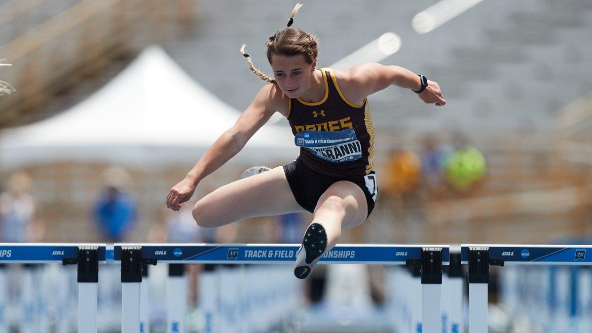 Nicole Notarianni jumps over a hurdle. Notarianni recorded a first place finish in the 100 meter hurdles during the Washington & Lee Carnival. - Photo / Rowan Athletics