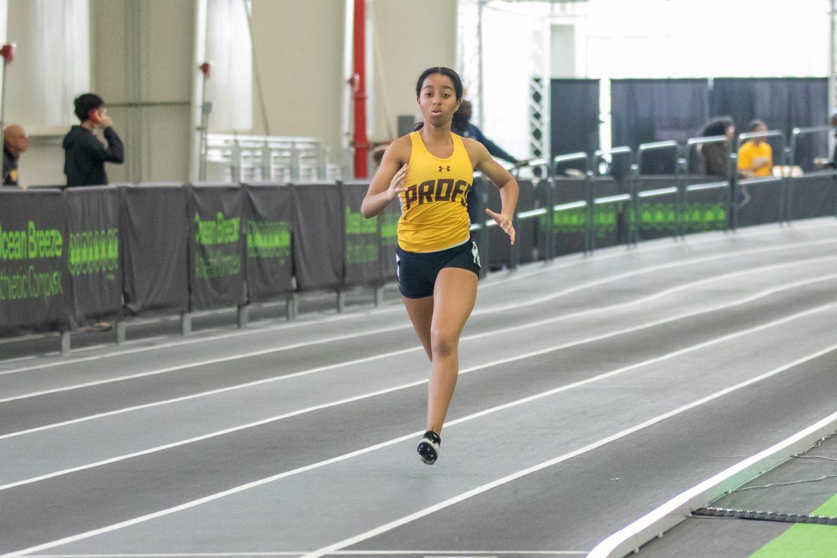 Paris Moore runs in a race. Moore has been a standout rookie for the team. Friday, Feb. 3, 2023. - Multimedia Editor / Lee Kotzen