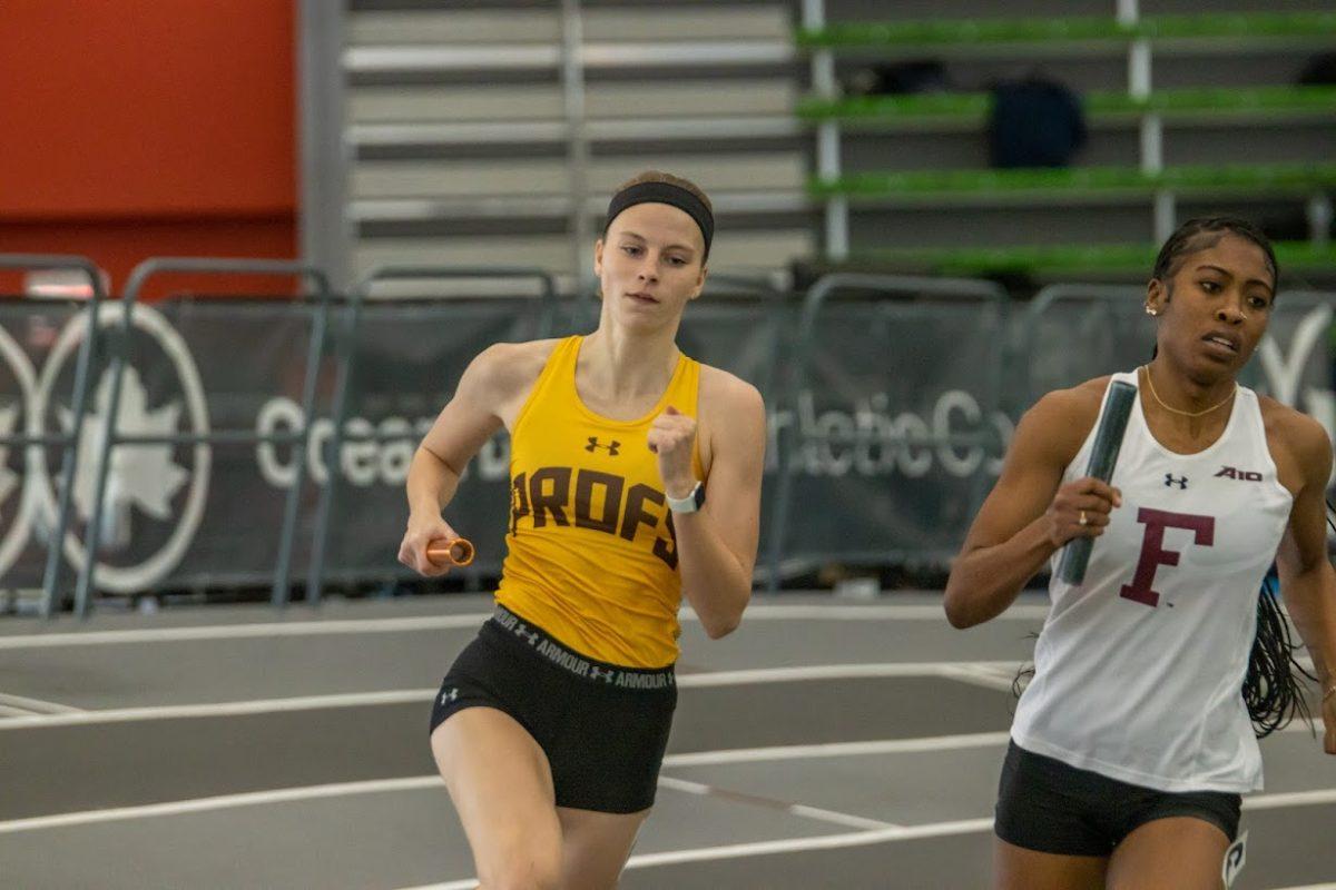 Molly Lodge runs in the 4x400. Lodge ran in the event at the FastTrack Last Chance meet. Friday, Feb. 3, 2023. - Multimedia Editor / Lee Kotzen