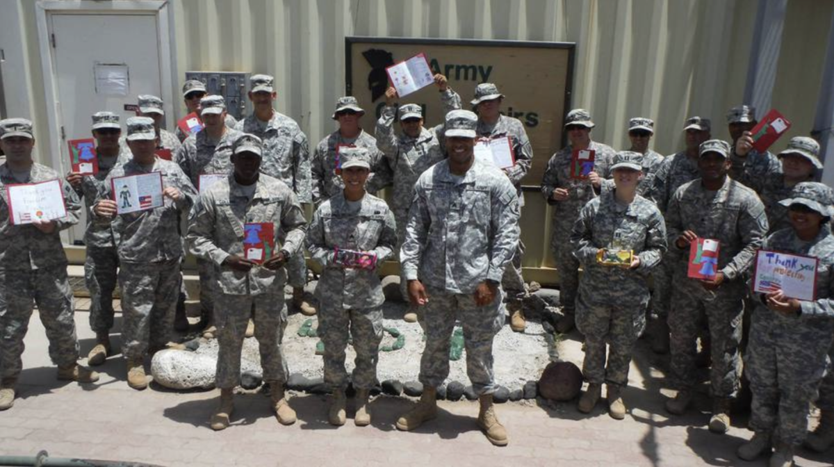 Active members show off their care packages from Operation Yellow Ribbon. - Photo / Operation Yellow Ribbon