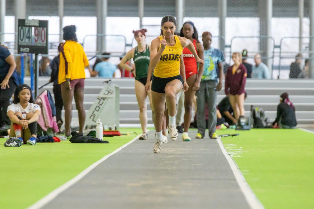 Amanthy Sosa Caceres participates in the long jump. Sosa Caceres was a part of the 4x200 team that broke the school record. Friday, Feb. 3, 2023. - Multimedia Editor / Lee Kotzen