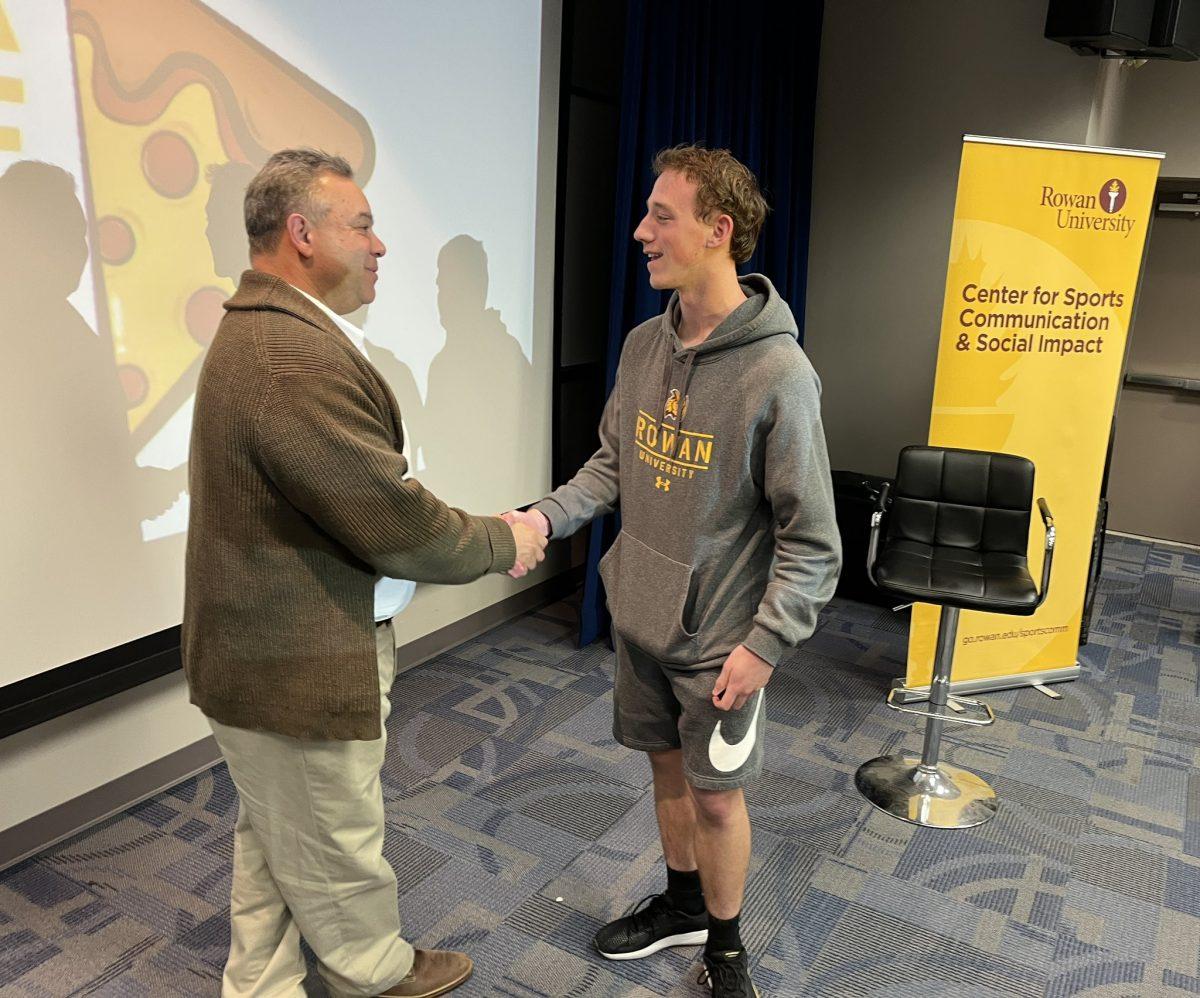 Marcus Hayes greeting Rowan Sports CaM student Tyler Delpercio following his discussion. - Photo / @rowansportscam on Twitter