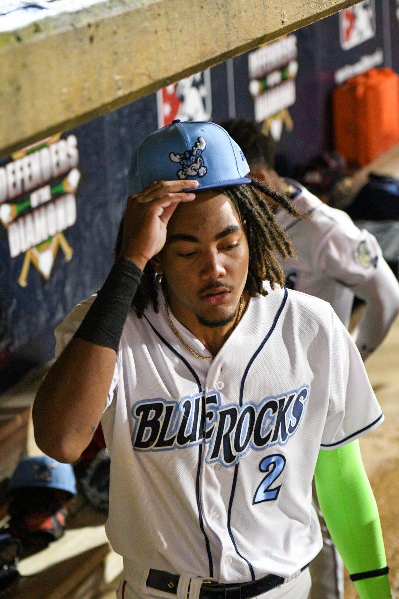 Blue Rocks slugger James Wood prepares to take the field from the home dugout. Wednesday, April 26, 2023. - Staff Photographer / Tyrese Williams