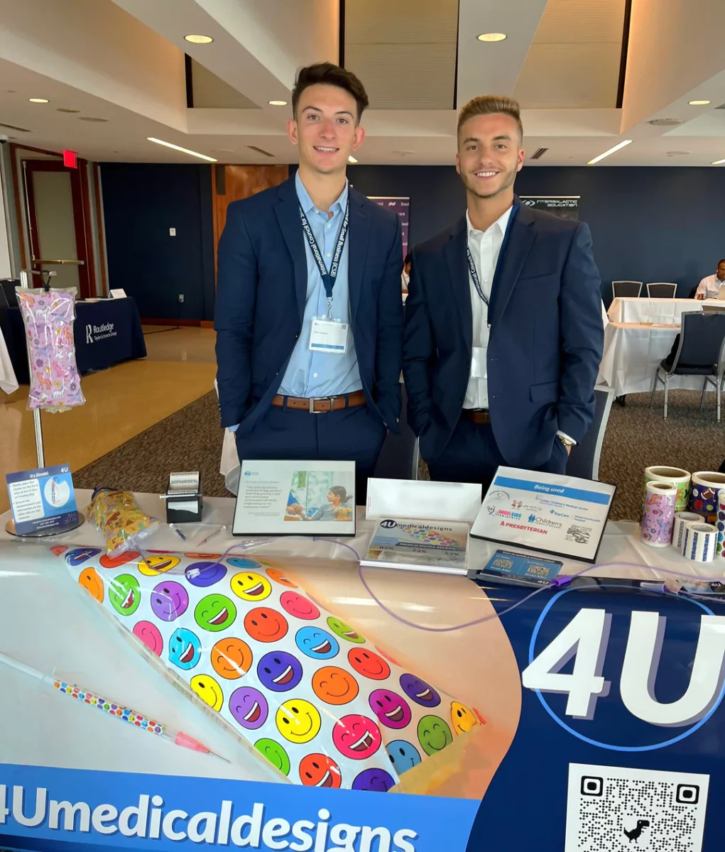 Nicholas Nastasi (left) and Joshua Perry (right) pitching their sticker products like IV bags, needles and rolls of stickers. - Photo via 4UMedicalDesigns.com