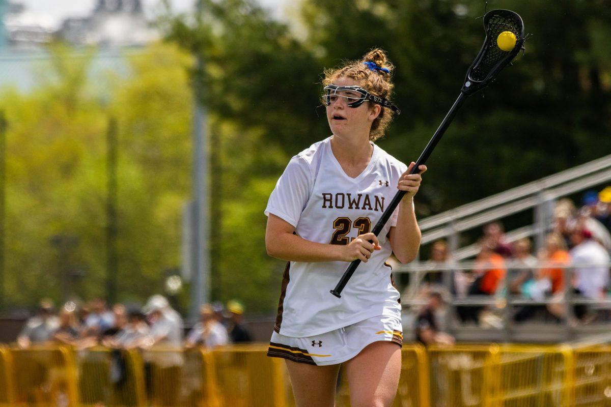 Elaina Corson cradles the ball. Corson scored four goals and had three assists in Saturday's win. Saturday, April 15, 2023. - Multimedia Editor / Lee Kotzen