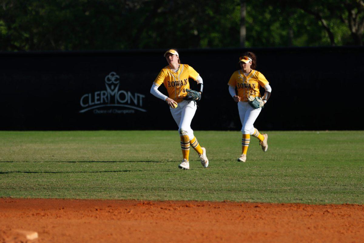 Abby Pawlowski runs in after catching a fly ball. Pawlowski is sixth on the team in hits. - Photo via Rowan Athletics