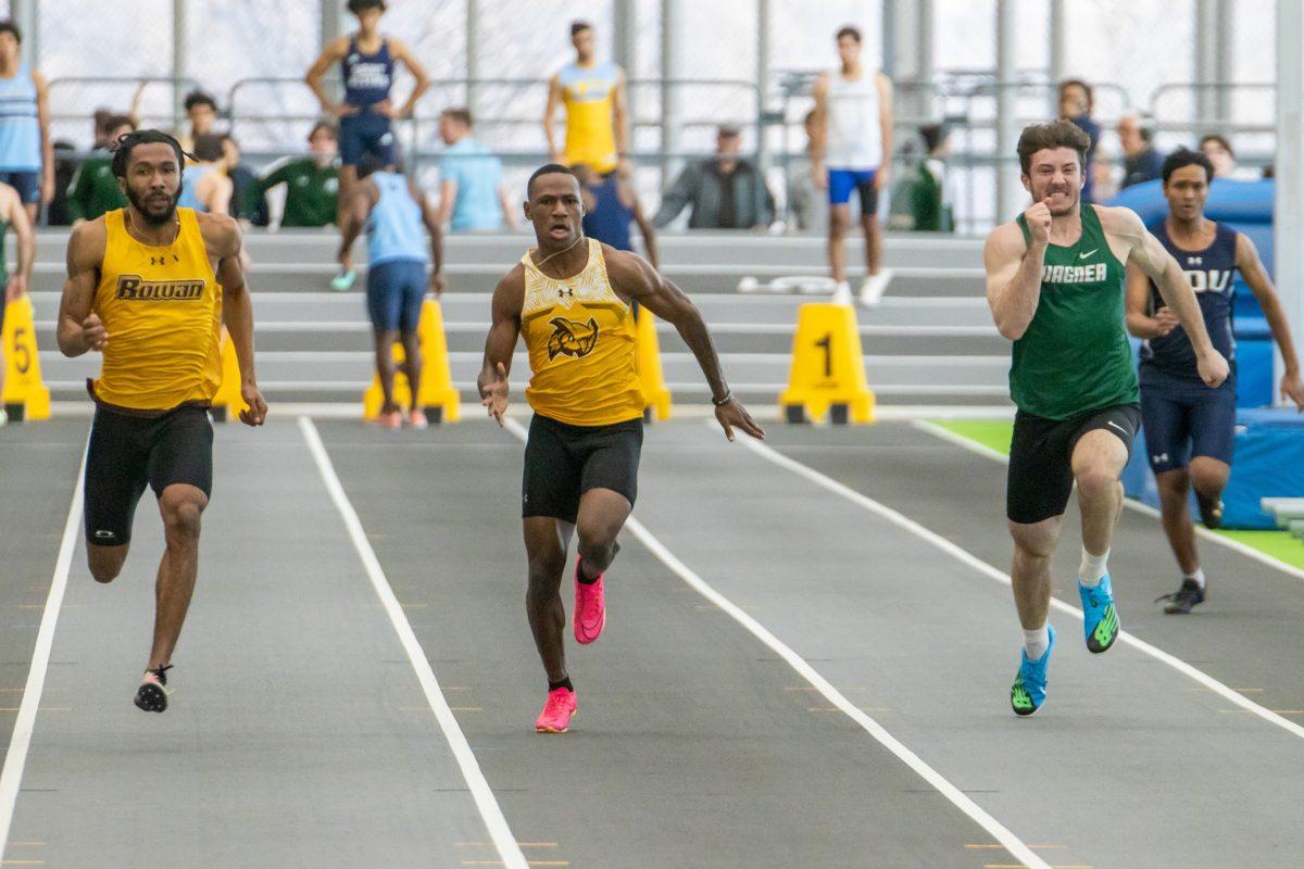 Jah'mere Beasley (left) and Shamar Love (right) run in a race. The two are a part of the 4x100 team that nearly broke the school record. Friday, Feb. 3, 2023. - Multimedia Editor / Lee Kotzen