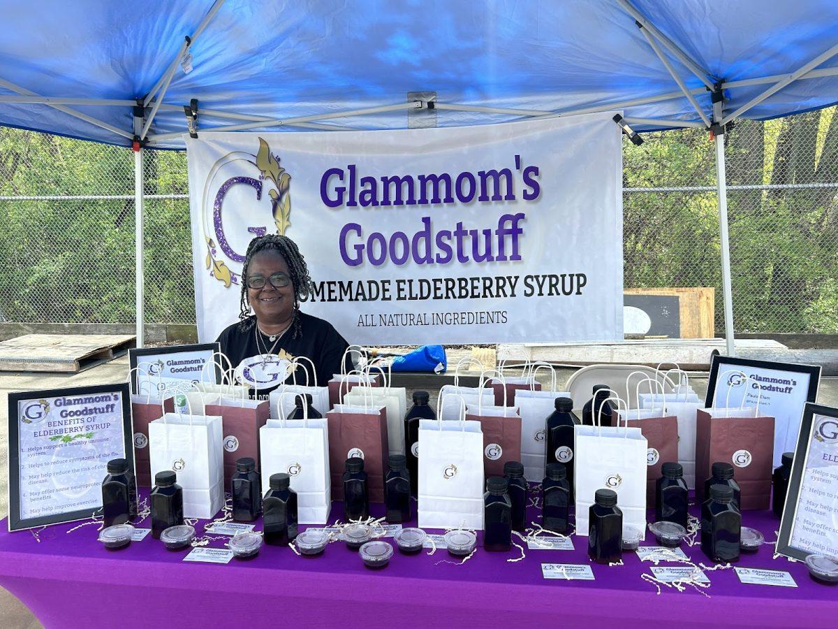 Paula Elam at her table, showcasing her business, Glammom’s Goodstuff. - Staff Writer / Maryela Gallardo 