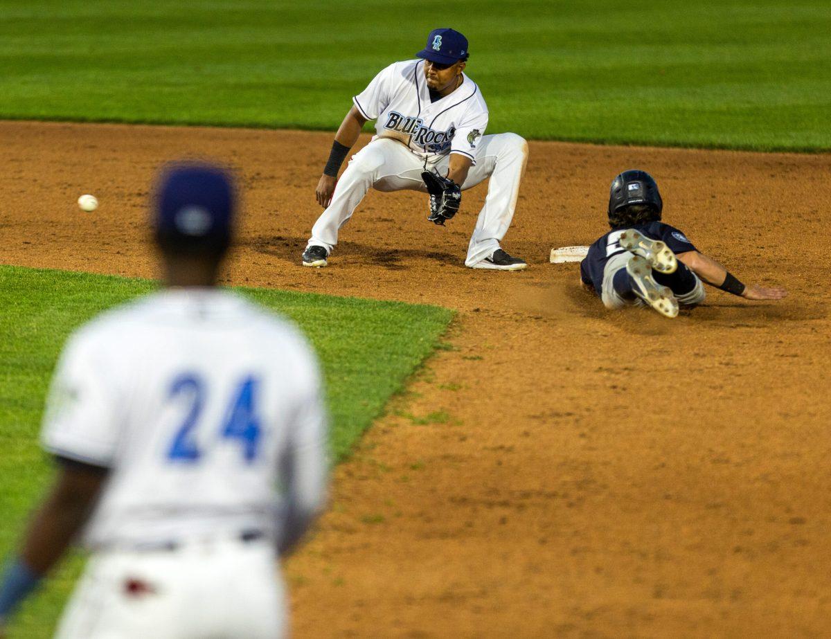 Blue Rocks shortstop Erick Mejia receives a throw from the catcher to catch a runner stealing second. Thursday, May 25, 2023. Staff Photographer / Joe Capuyan