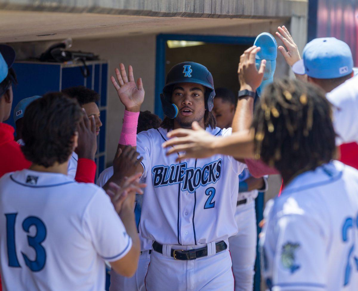 James Wood celebrates in the dugout after scoring in the first inning. Sunday, May 14, 2023. - Staff Photographer / Joe Capuyan