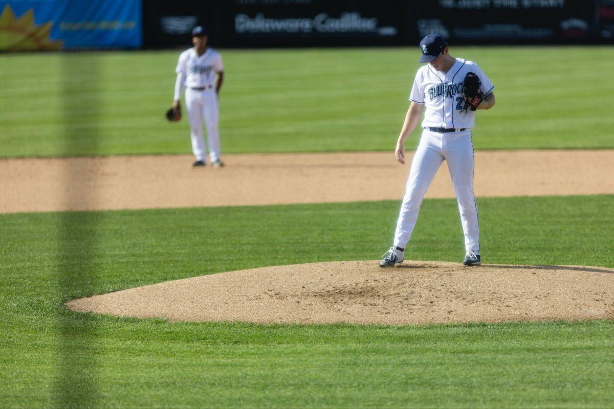 RHP Kyle Luckham cleans off the rubber before his start. Tuesday, July 4, 2023. - Photo via @WilmBlueRocks on Twitter